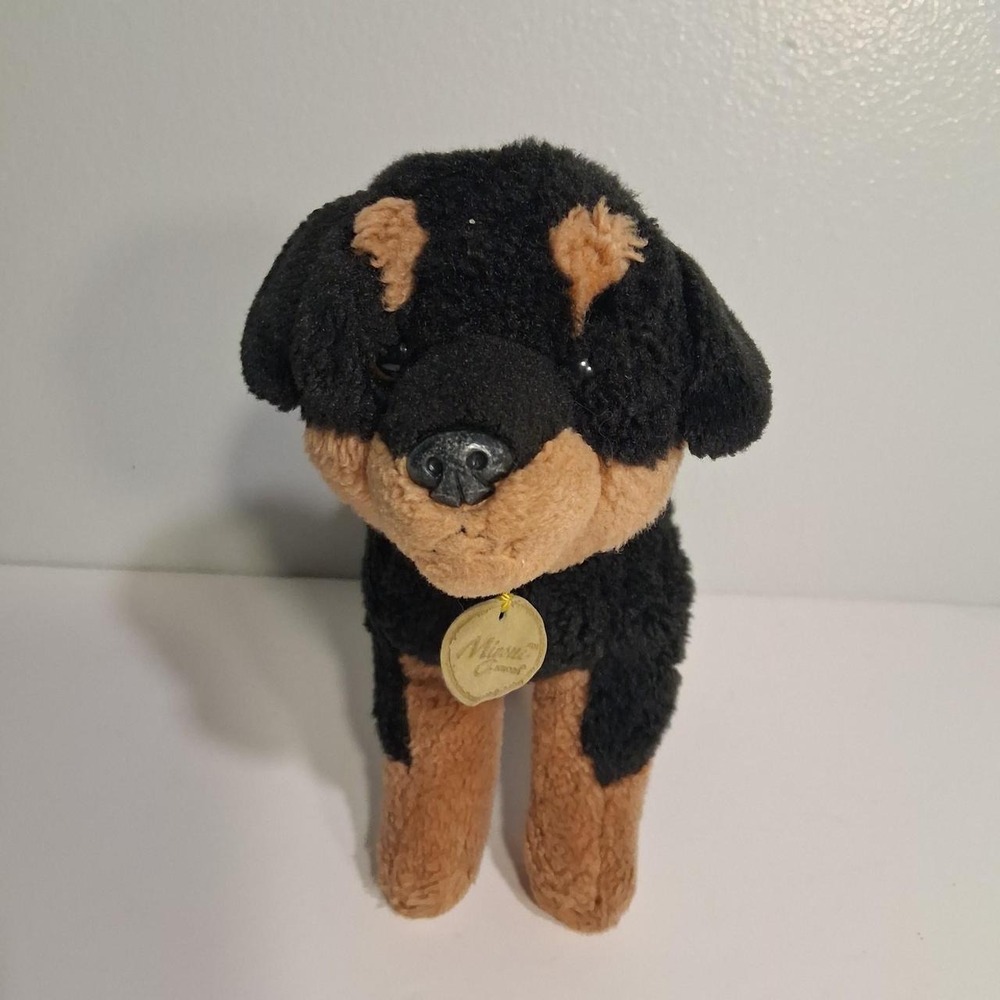 Super cute Rottweiler plush dog with black fur and tan markings